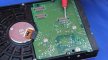stock-footage-test-lead-touching-hdd-card-surface.jpg